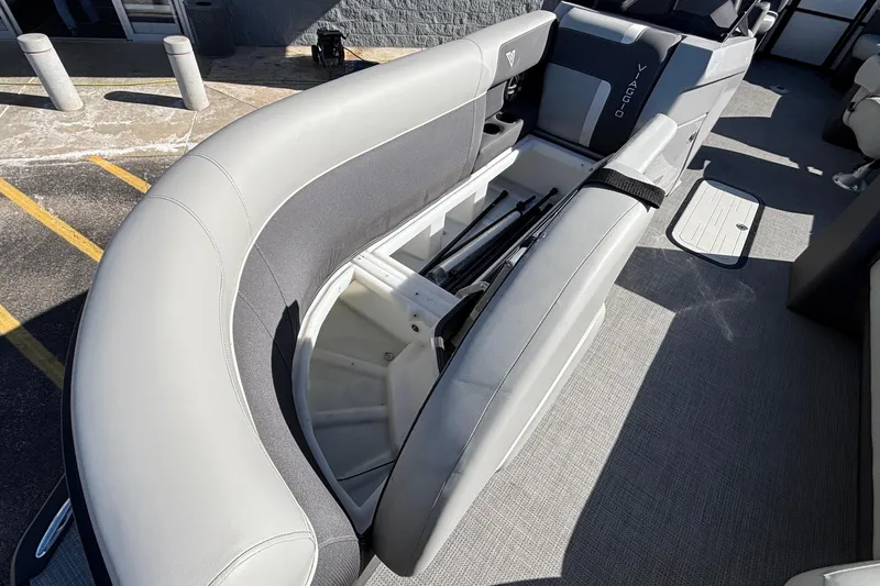 Slide: The Image of 2026 Viaggio X24U boat interior with open storage compartment and gray seating. - 14