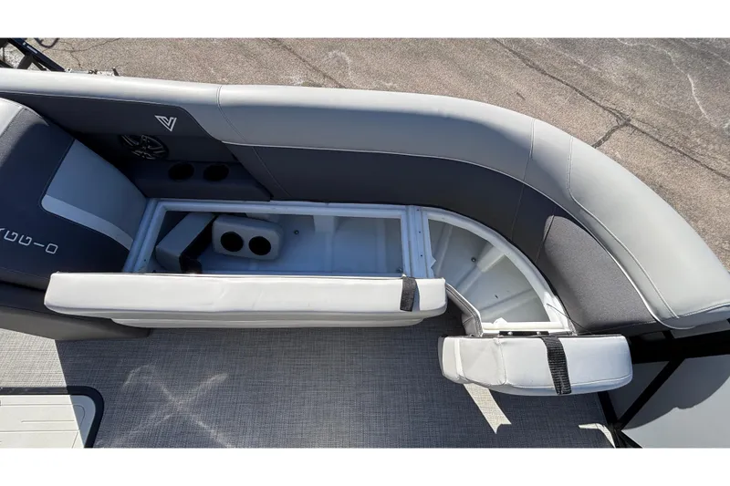 Slide: The Image of 2026 Viaggio X24U boat interior with open storage compartment and cup holders. - 15