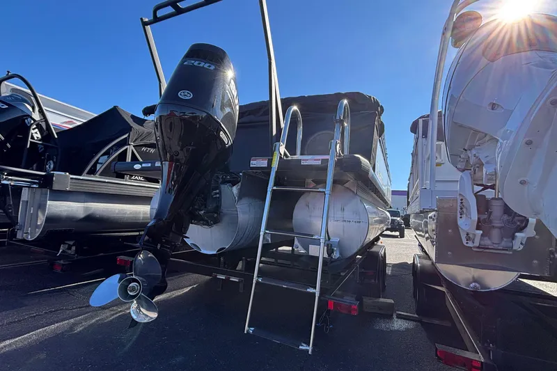 Slide: The Image of 2026 Viaggio X24U pontoon boat with powerful outboard motor in a sunny marina. - 22