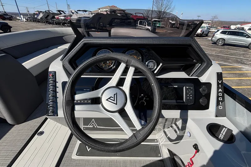 Slide: The Image of 2026 Viaggio X24U boat dashboard with steering wheel and control panel. - 6
