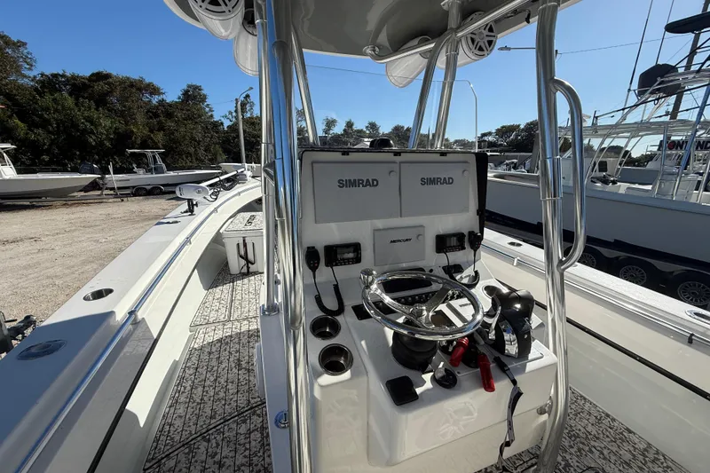 Slide: The Image of 2016 Contender 35 ST boat cockpit with Simrad electronics and Mercury controls. - 14