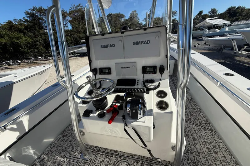 Slide: The Image of 2016 Contender 35 ST boat console with Simrad electronics and Mercury controls. - 17