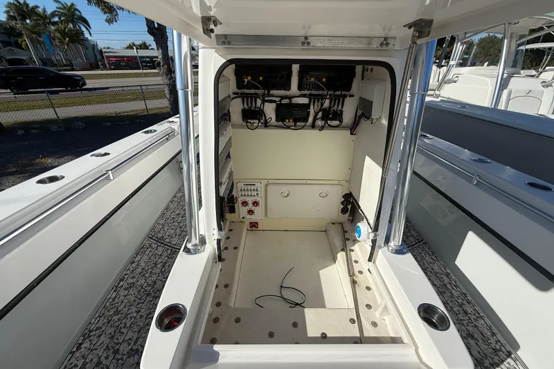 Slide: The Image of 2016 Contender 35 ST boat interior with open console and visible wiring. - 4