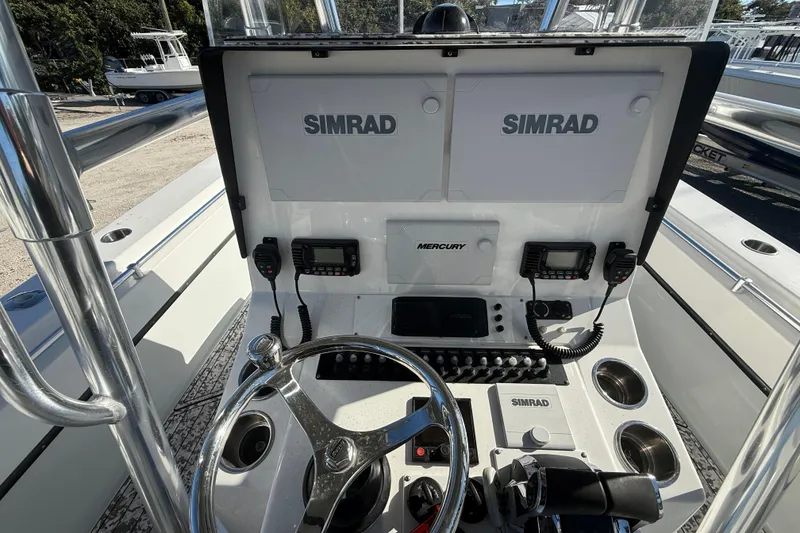 Slide: The Image of 2016 Contender 35 ST boat dashboard with Simrad electronics and Mercury controls. - 5