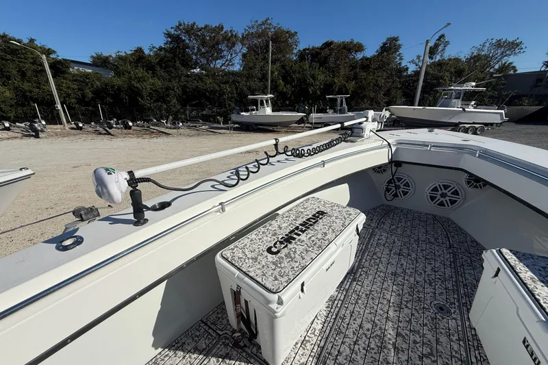 Slide: The Image of 2016 Contender 35 ST boat interior with fishing gear and storage compartments. - 8