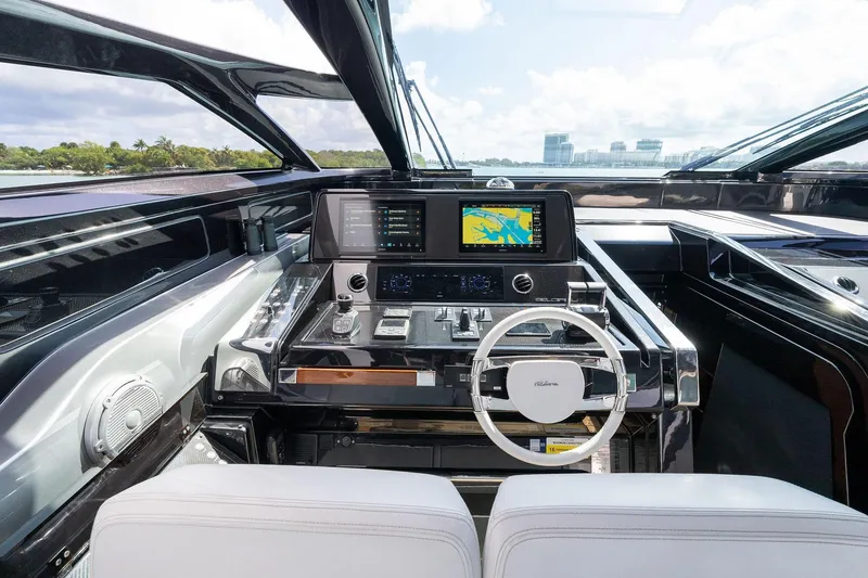 Slide: The Image of Luxurious 2023 Riva 68 Diable yacht cockpit with modern navigation system and sleek design. - 17