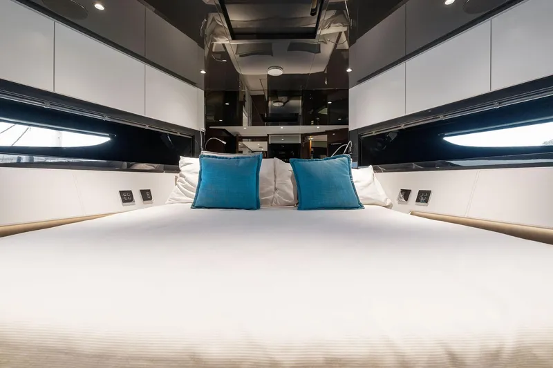 Slide: The Image of Luxurious interior of 2023 Riva 68 Diable yacht with elegant bedding and modern design. - 35