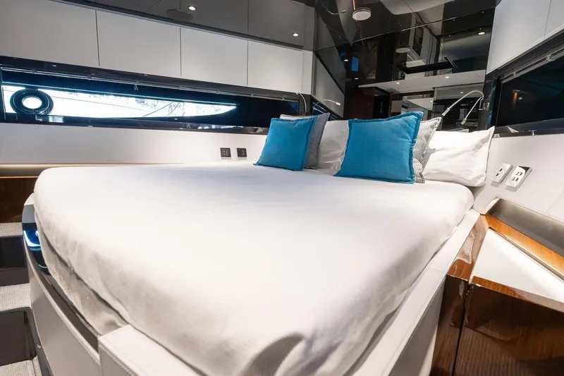 Slide: The Image of Luxurious interior of 2023 Riva 68 Diable yacht with elegant bedding and modern design. - 36