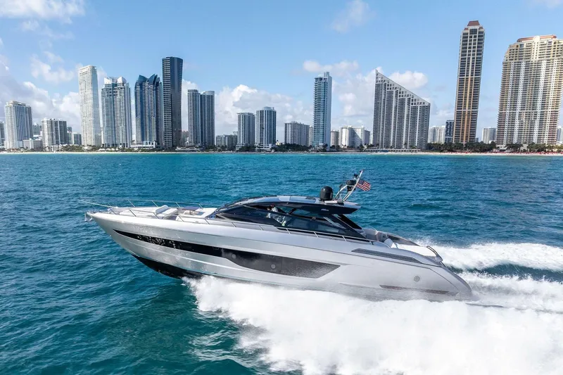 Slide: The Image of 2023 Riva 68 Diable luxury yacht cruising on open ocean waters. - 4