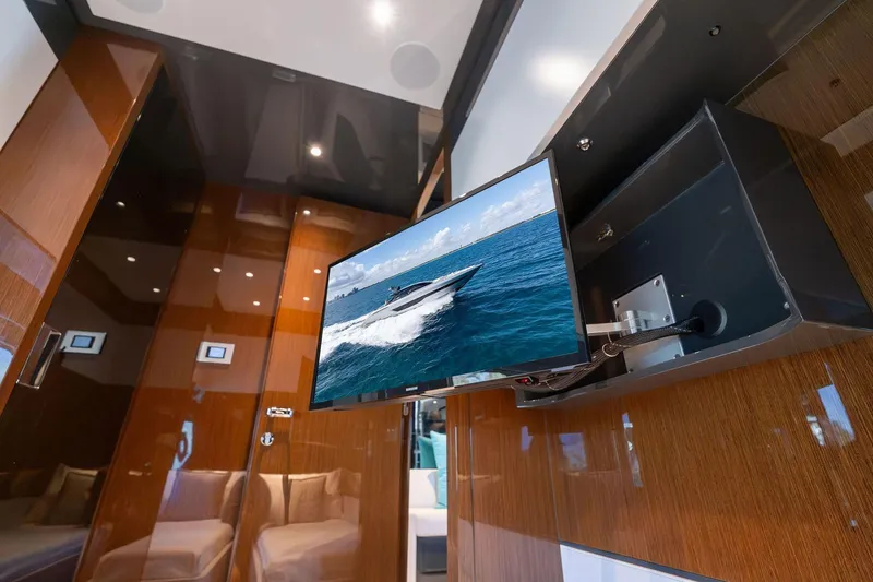 Slide: The Image of Luxurious interior of 2023 Riva 68 Diable yacht with mounted TV display. - 41