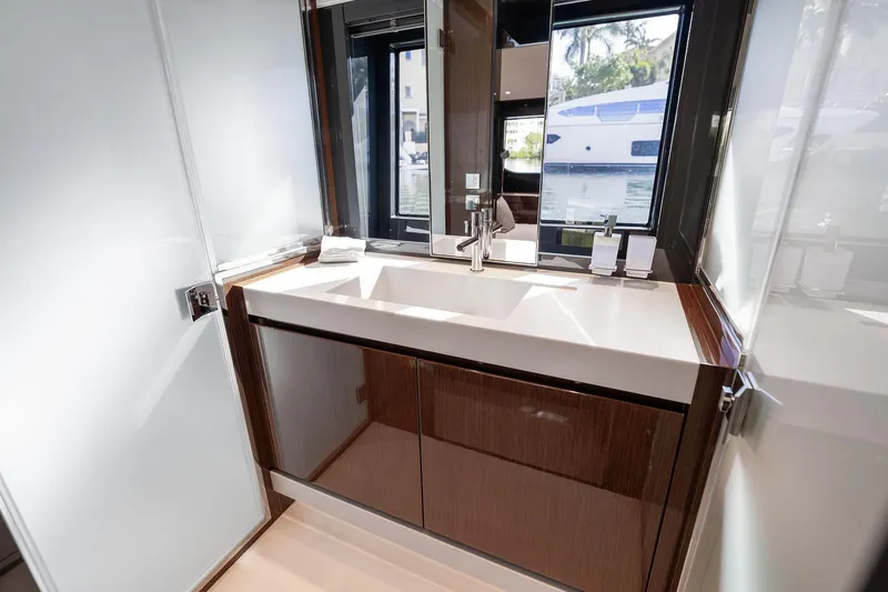 Slide: The Image of Luxurious bathroom interior of 2023 Riva 68 Diable yacht with modern sink and window view. - 48