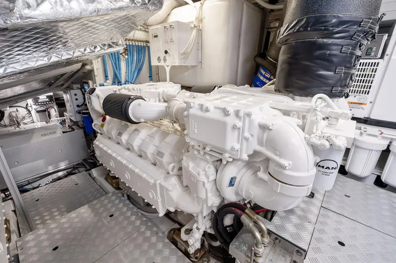 Slide: The Image of Engine room of 2023 Riva 68 Diable yacht, featuring a powerful MAN engine. - 55