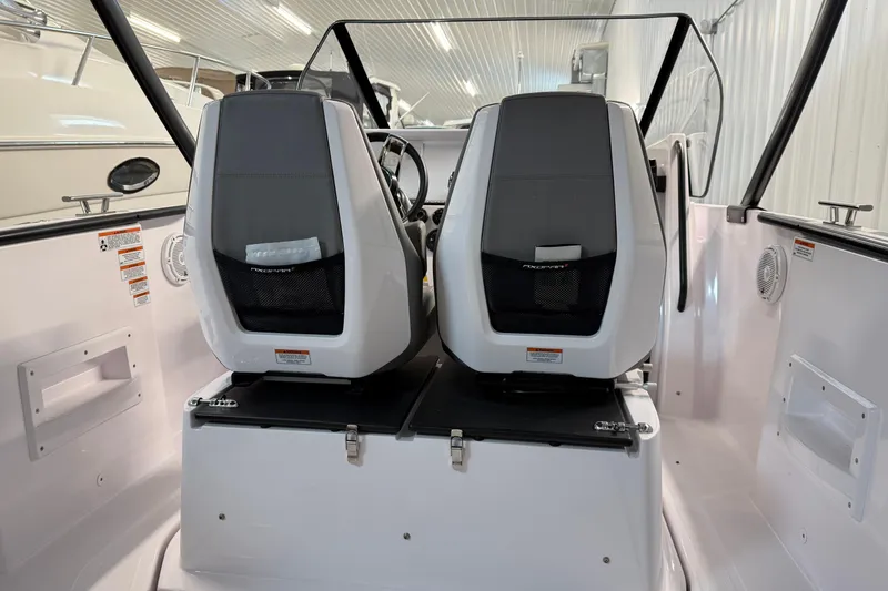 Slide: The Image of 2023 Axopar 25 Cross Bow interior with dual seats and modern design. - 13