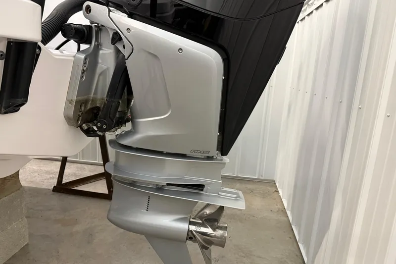 Slide: The Image of Outboard motor of 2023 Axopar 25 Cross Bow boat in a storage area. - 20