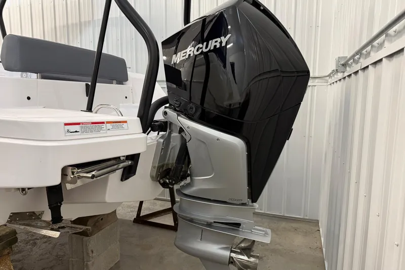 Slide: The Image of 2023 Axopar 25 Cross Bow with Mercury outboard engine in storage. - 21