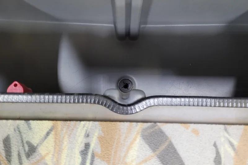Slide: The Image of Interior view of 2025 Ranger RB210 boat compartment with drain plug. - 13