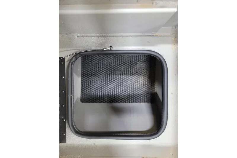 Slide: The Image of Interior view of 2025 Ranger RB210 storage compartment with textured mat. - 18