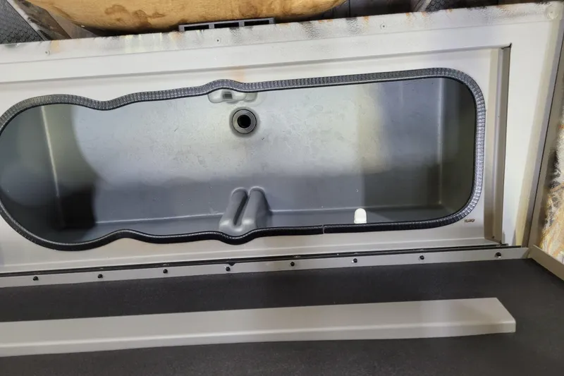 Slide: The Image of Open compartment of 2025 Ranger RB210, showcasing interior design and storage space. - 22