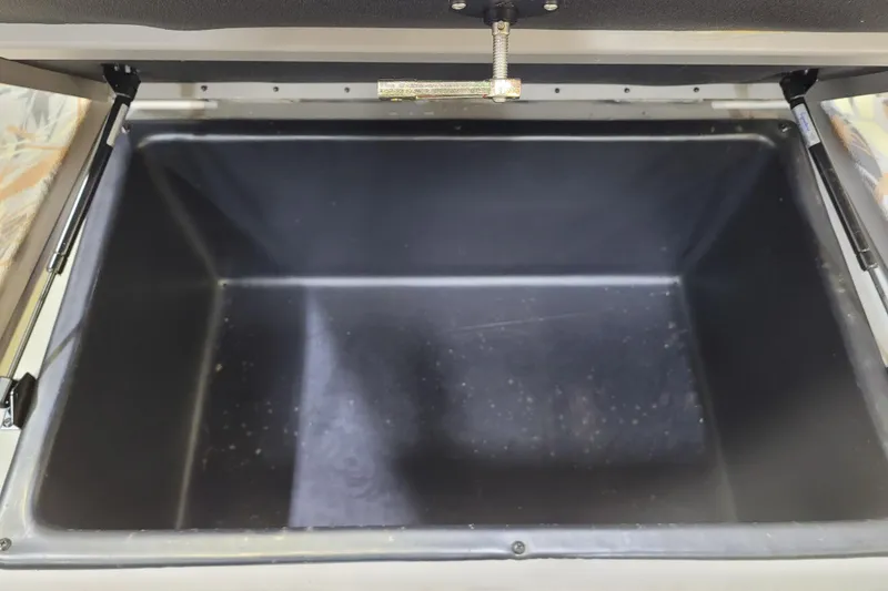 Slide: The Image of Open storage compartment of 2025 Ranger RB210 boat, featuring spacious interior. - 23