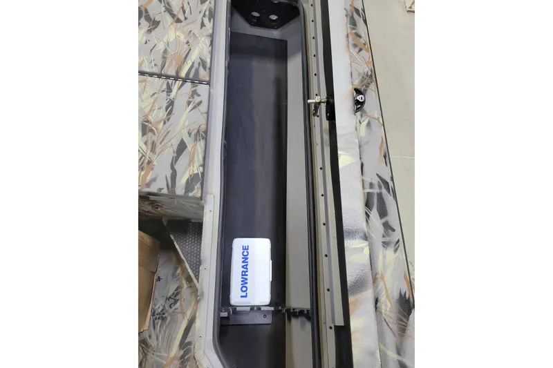 Slide: The Image of 2025 Ranger RB210 boat interior with Lowrance equipment and camouflage design. - 24