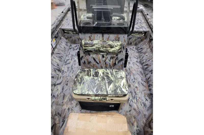 Slide: The Image of 2025 Ranger RB210 boat interior with camouflage seating and console design. - 27