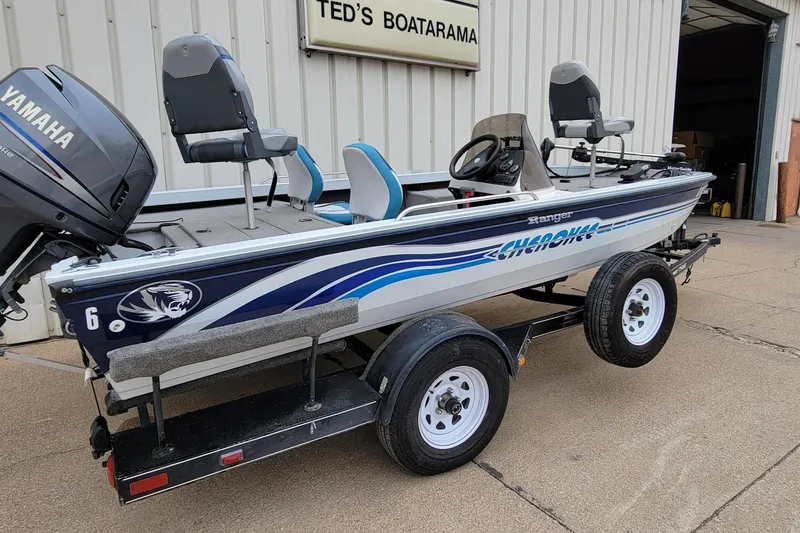 Slide: The Image of 1999 Ranger 107 Cherokee boat with Yamaha motor on trailer at Ted's Boatarama. - 18