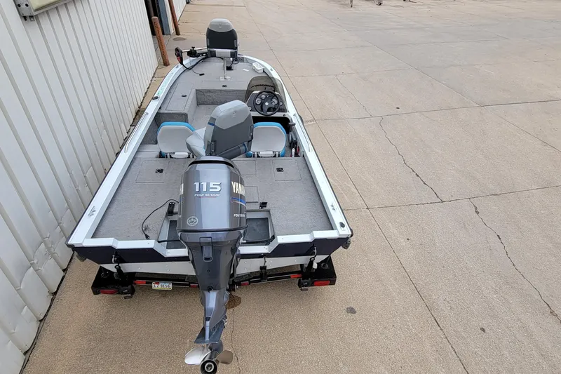 Slide: The Image of 1999 Ranger 107 Cherokee boat with Yamaha 115 engine on a trailer. - 9