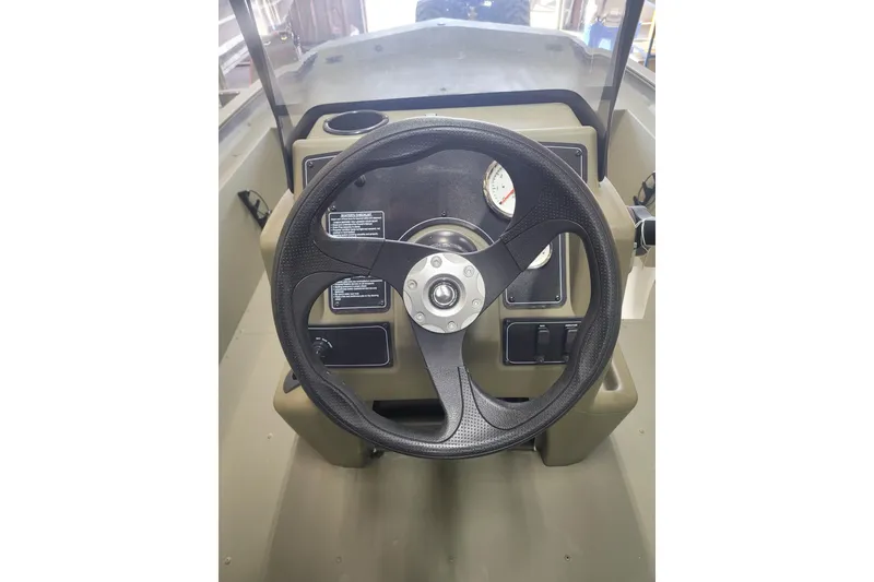 Slide: The Image of Steering console of 2026 Tracker Grizzly 1860 CC boat, featuring a modern design. - 7