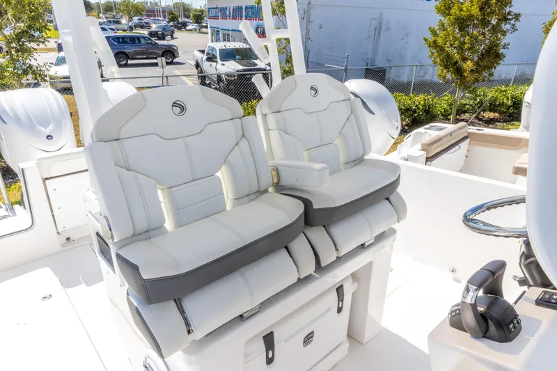 Slide: The Image of Luxury seating on 2026 Edgewater 285CC boat, featuring plush white upholstery and modern design. - 20