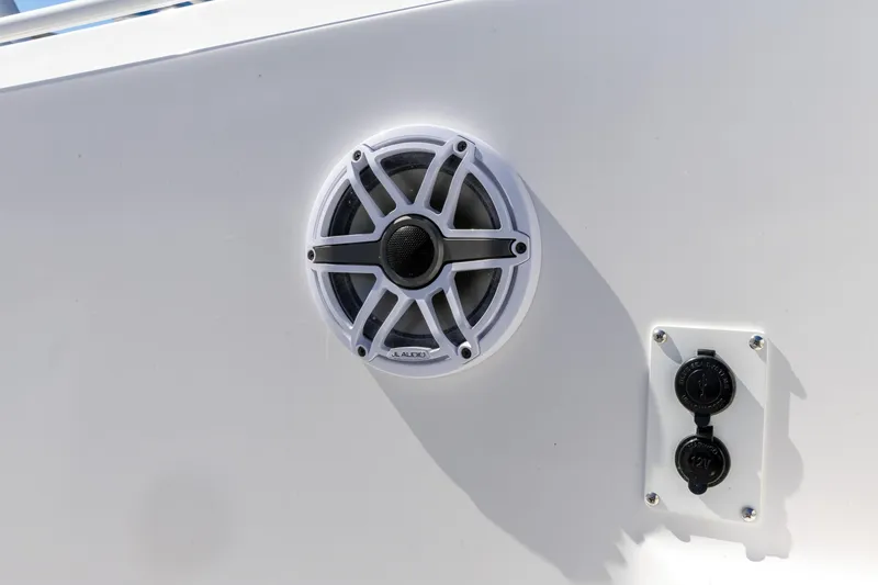 Slide: The Image of 2026 Edgewater 285CC boat speaker and power outlets on white panel. - 22