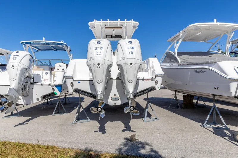 Slide: The Image of 2026 Edgewater 285CC boat with dual 370 V6 engines on display. - 7