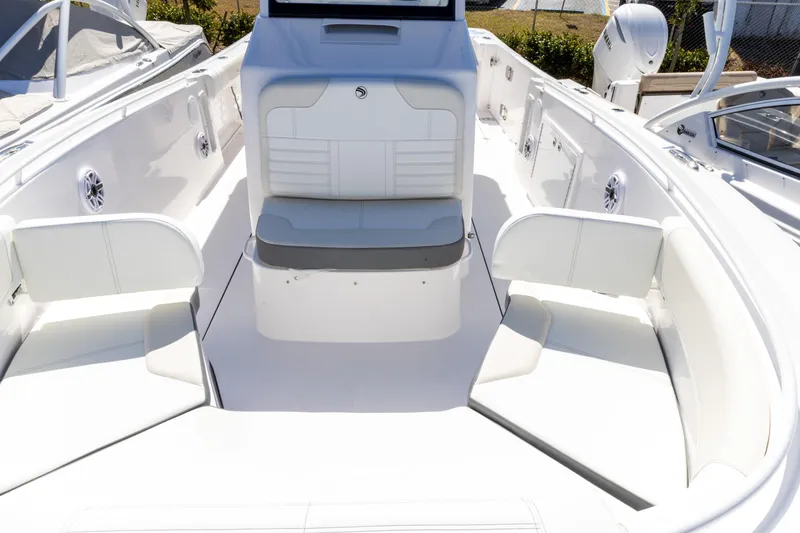 Slide: The Image of 2026 Edgewater 285CC boat interior with white seating and modern design. - 9
