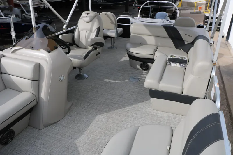 Slide: The Image of 2021 Trifecta 22 RFC pontoon boat interior with plush seating and modern helm. - 20