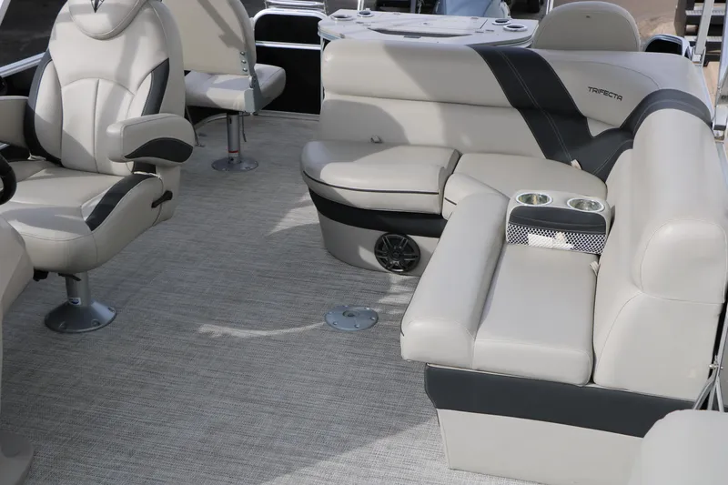 Slide: The Image of Luxurious interior of 2021 Trifecta 22 RFC pontoon boat with plush seating and cup holders. - 22