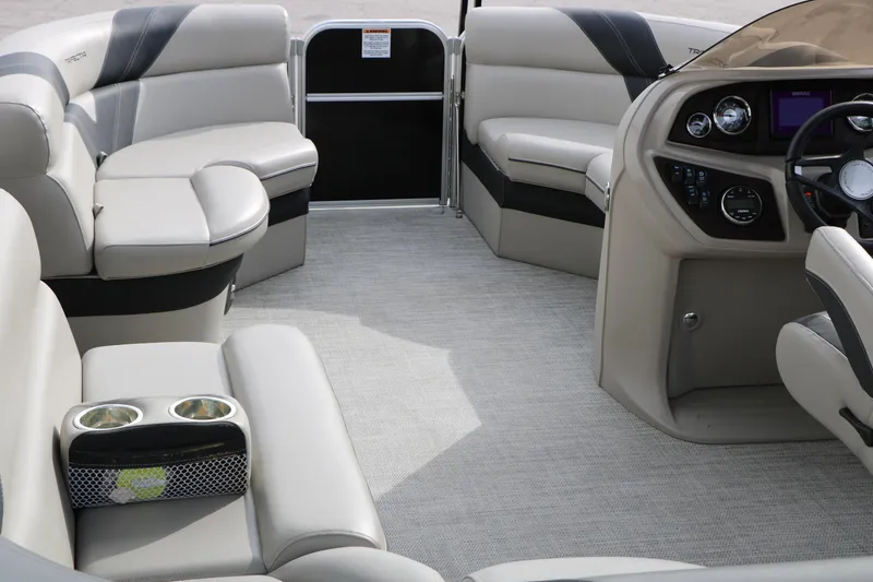 Slide: The Image of Luxurious interior of 2021 Trifecta 22 RFC pontoon boat with plush seating and modern dashboard. - 26