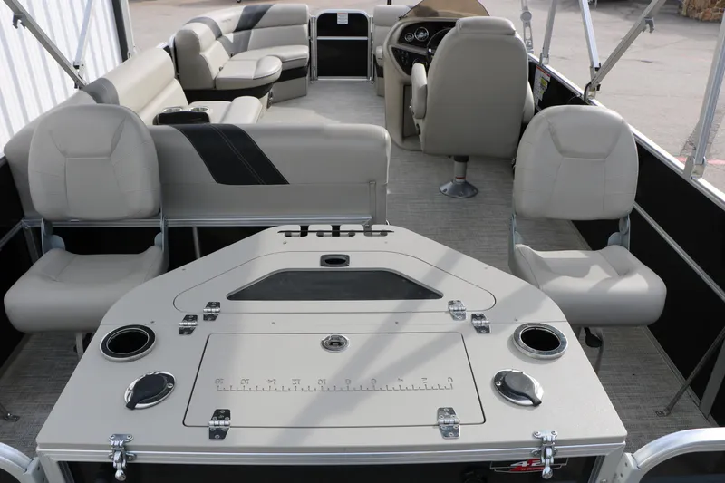Slide: The Image of Interior of a 2021 Trifecta 22 RFC pontoon boat with seating and control panel. - 27