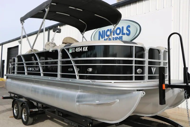 Slide: The Image of 2021 Trifecta 22 RFC pontoon boat on trailer at Nichols Marine dealership. - 3