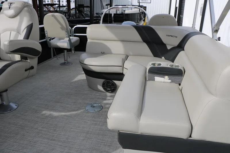 Slide: The Image of 2021 Trifecta 22 RFC boat interior with plush seating and cup holders. - 31