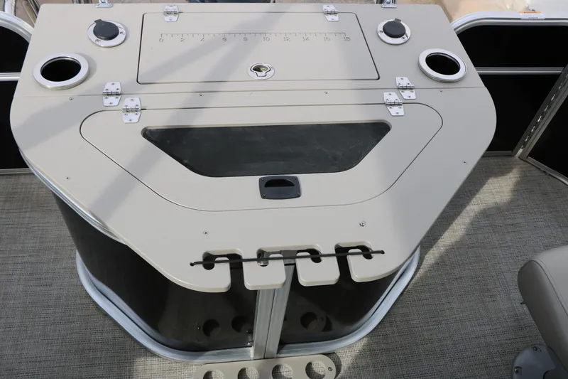 Slide: The Image of 2021 Trifecta 22 RFC boat console with cup holders and storage compartments. - 32