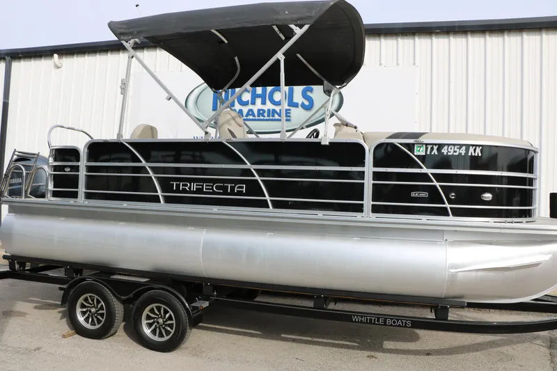 Slide: The Image of 2021 Trifecta 22 RFC pontoon boat on trailer at Nichols Marine. - 8