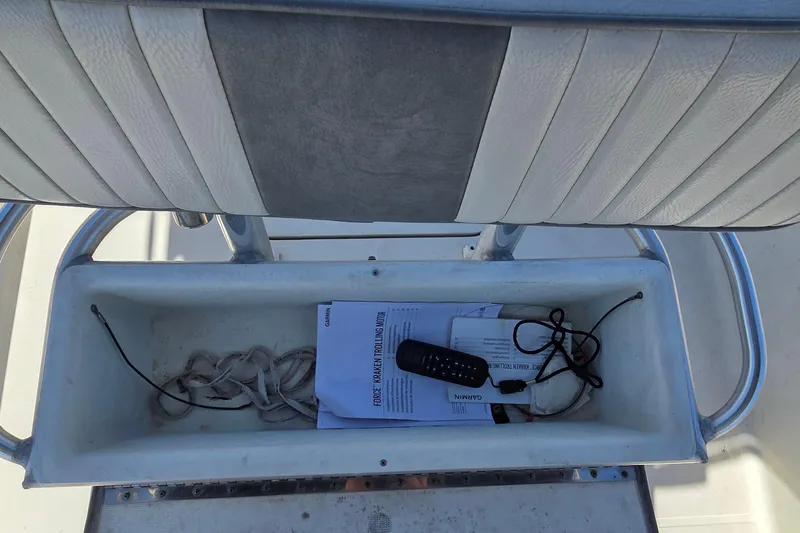 Slide: The Image of Storage compartment on 2008 Hydra-Sports Bay Bolt 23 boat with manuals and equipment. - 11