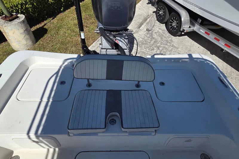 Slide: The Image of 2008 Hydra-Sports Bay Bolt 23 boat interior with seating and motor view. - 12