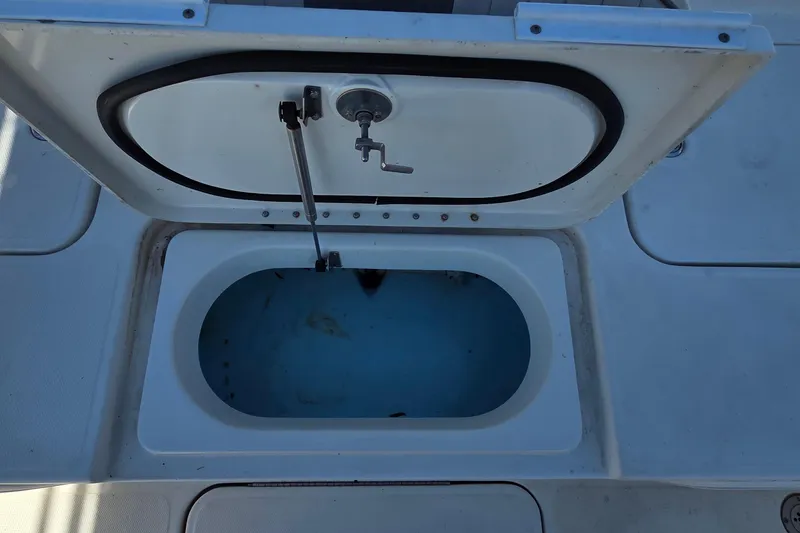 Slide: The Image of Open storage compartment on a 2008 Hydra-Sports Bay Bolt 23 boat. - 13