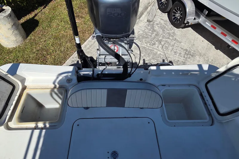 Slide: The Image of 2008 Hydra-Sports Bay Bolt 23 boat with Yamaha 200 engine, featuring storage compartments. - 14