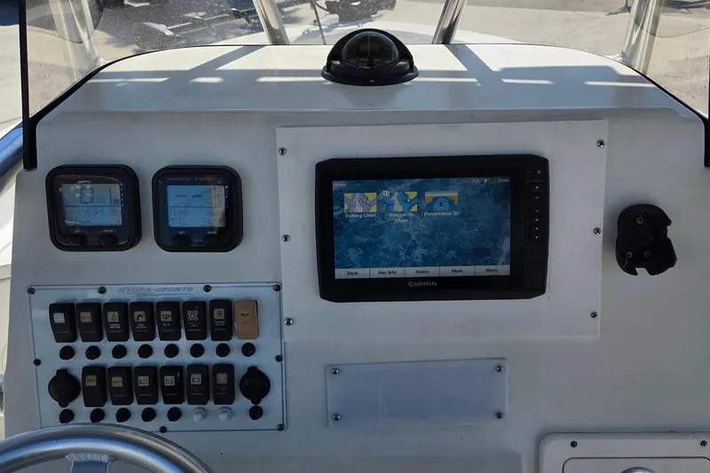 Slide: The Image of 2008 Hydra-Sports Bay Bolt 23 dashboard with Garmin navigation system and control panel. - 9