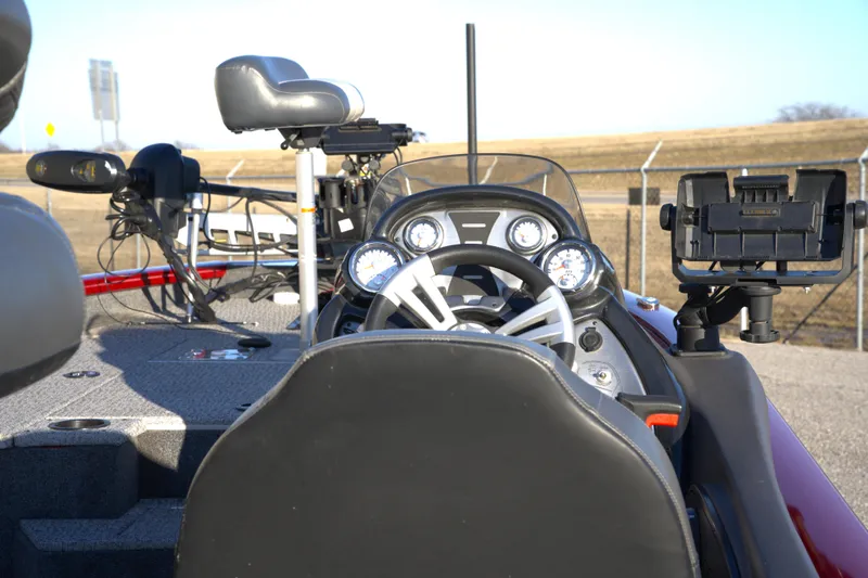 Slide: The Image of 2020 Tracker Pro Team 175 TXW Tournament Edition boat cockpit with steering wheel and gauges. - 2
