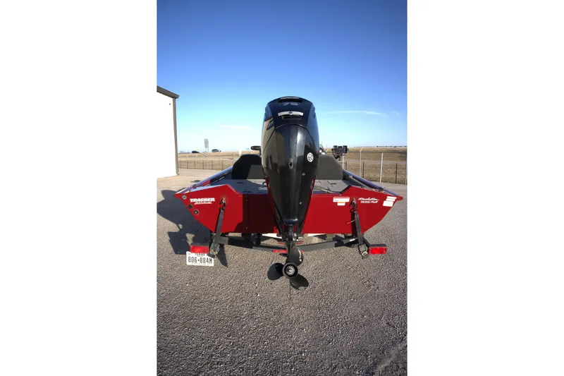 Slide: The Image of 2020 Tracker Pro Team 175 TXW Tournament Edition boat, rear view with outboard motor. - 3
