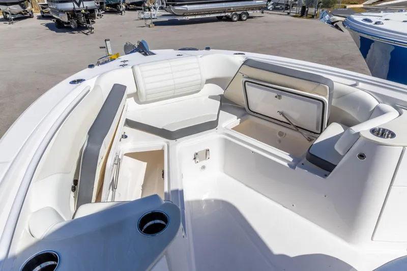 Slide: The Image of 2026 Edgewater 262CC boat interior with seating and storage compartments. - 23