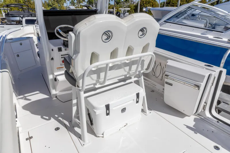 Slide: The Image of Edgewater 262CC 2026 boat interior with helm seats and storage compartments. - 5