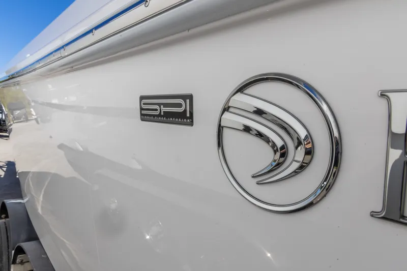 Slide: The Image of 2026 Edgewater 262CC boat with SPI logo on white hull. - 9